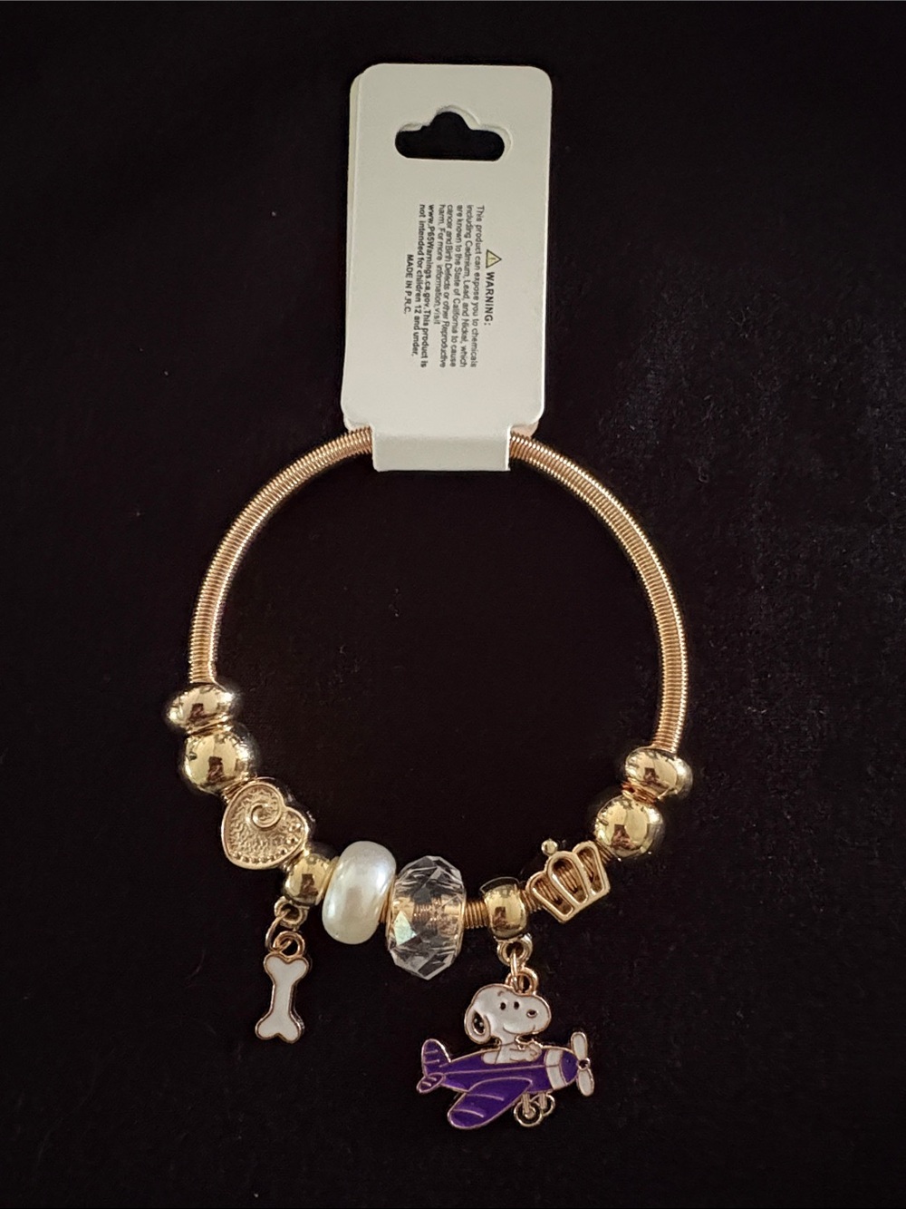 Gold-Tone Snoopy Stretchy Charm Bracelet with Purple Airplane & Pearl Accents